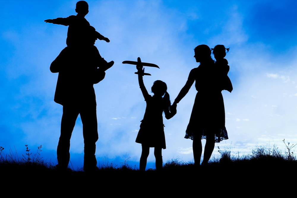 happy-family-by-sea-nature-silhouette-background